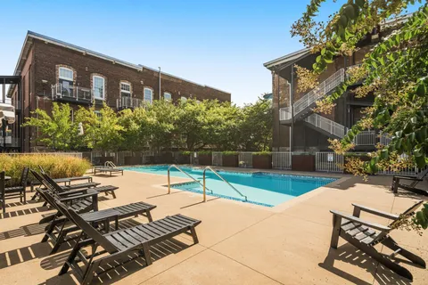 a view of a backyard with sitting area