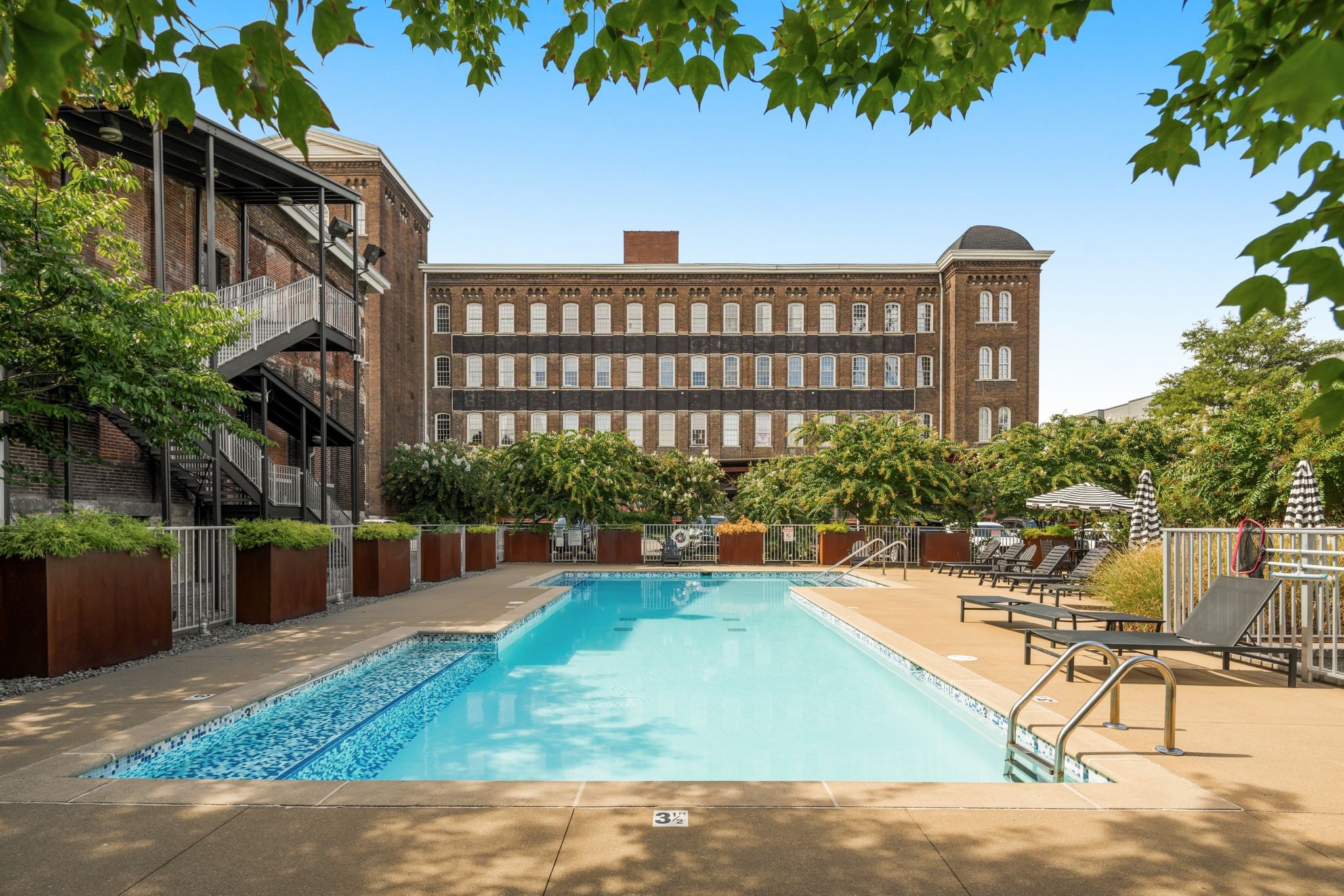 1400 Rosa L Parks Boulevard, Unit 211 Nashville, TN 37208 - Photo 26 of 36 a view of a swimming pool with a patio