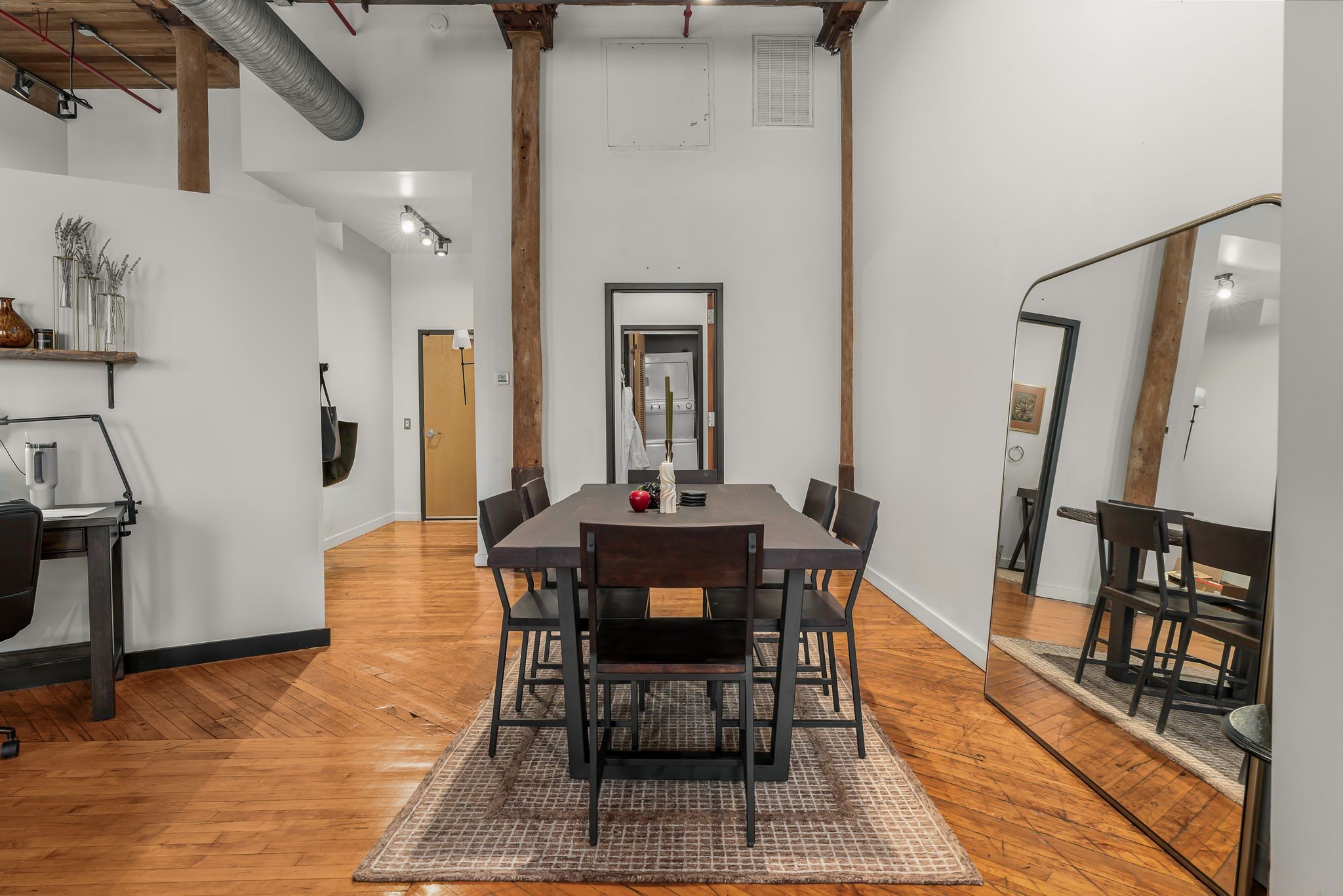 1400 Rosa L Parks Boulevard, Unit 211 Nashville, TN 37208 - Photo 9 of 36 a dining room with furniture and wooden floor