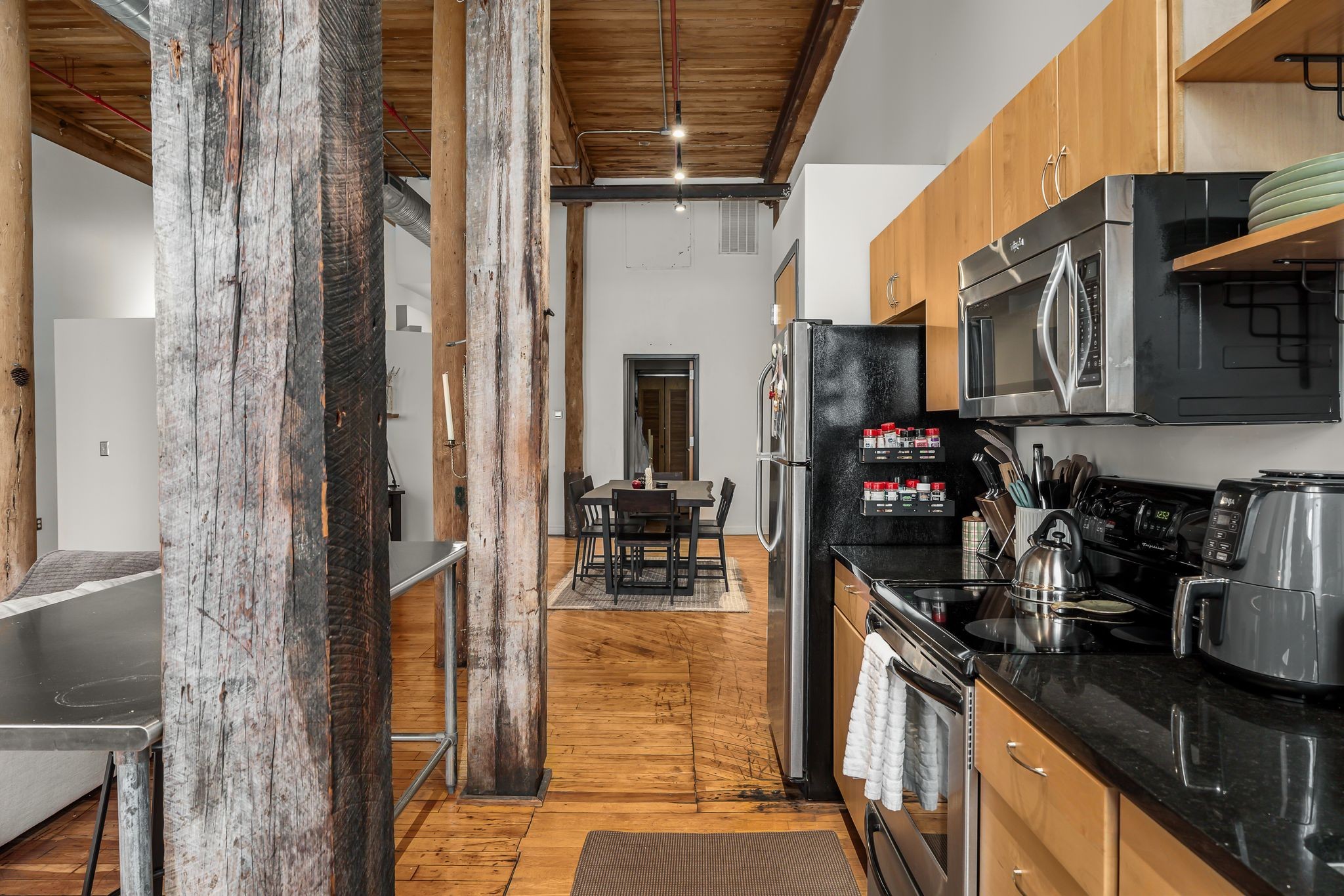 1400 Rosa L Parks Boulevard, Unit 211 Nashville, TN 37208 - Photo 10 of 36 a kitchen with stainless steel appliances granite countertop a refrigerator and a stove top oven