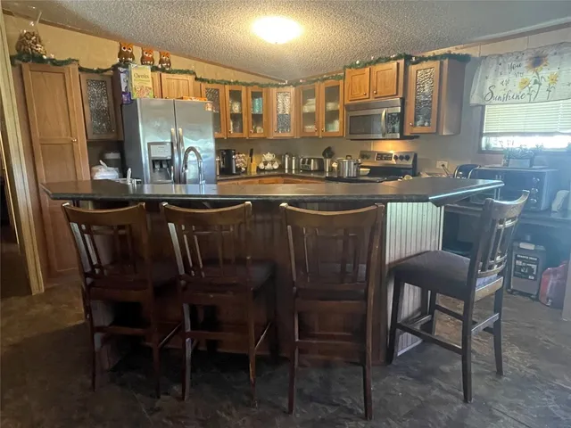 a dining table with chairs and window