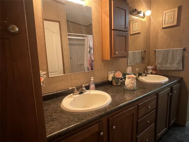 a bathroom with a shower and a tub