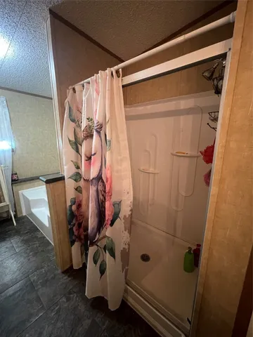 a bathroom with a tub and a sink