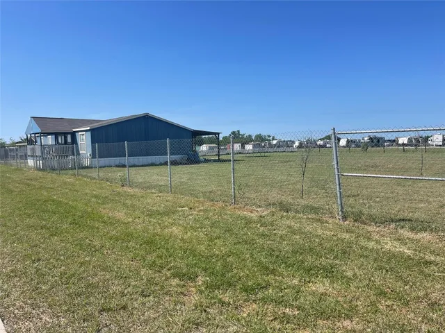 a view of a lake with a yard