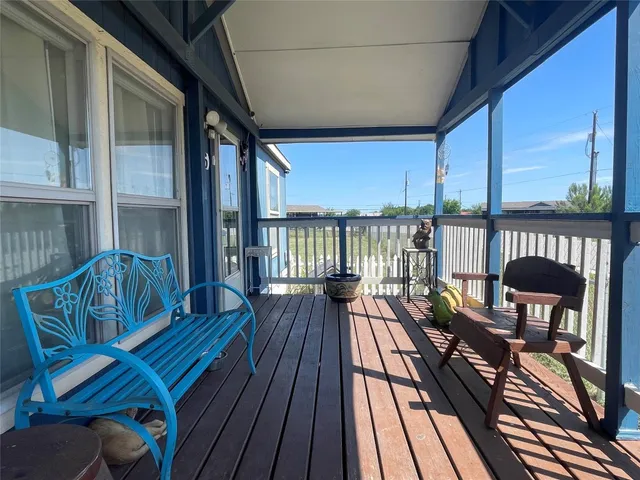 a view of balcony with wooden floor