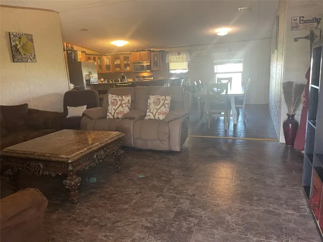 a living room with couches chairs and a coffee table