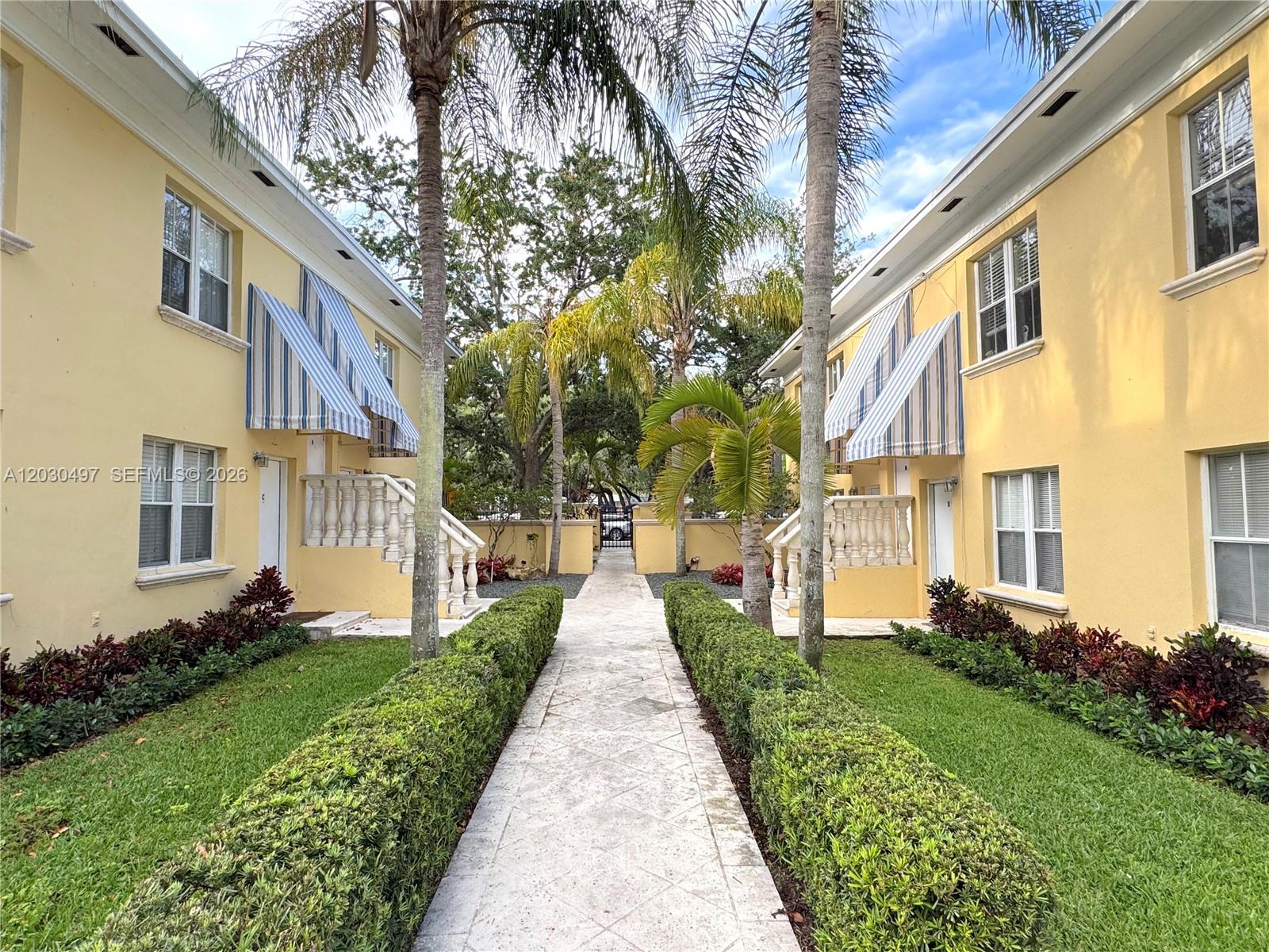 3375 Franklin Avenue, Unit D Miami, FL 33133 - Photo 3 of 29 a view of a building with a yard