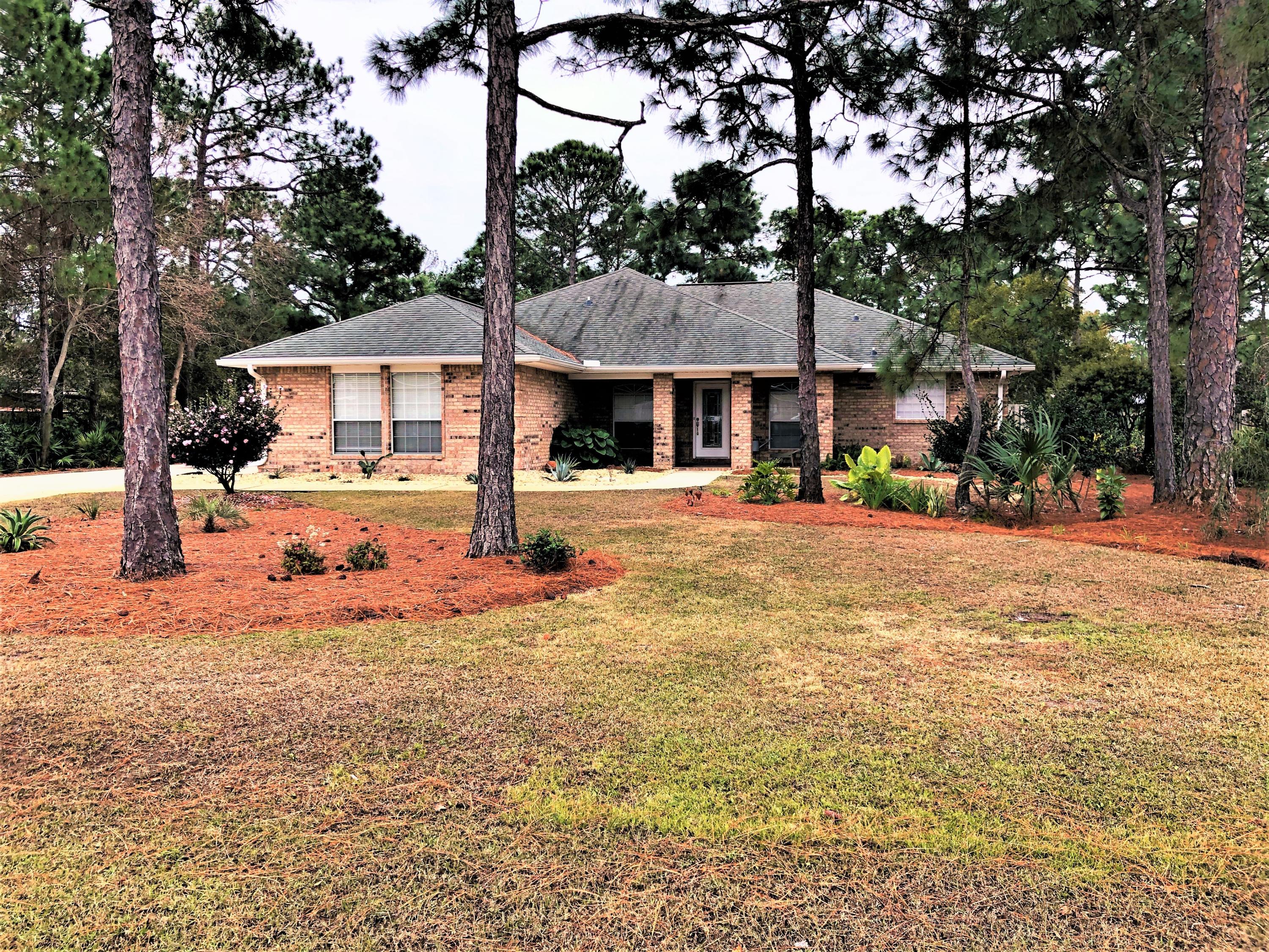 44 East Shipwreck Road Santa Rosa Beach, FL 32459 - Photo 1 of 33 a front view of a house with a patio