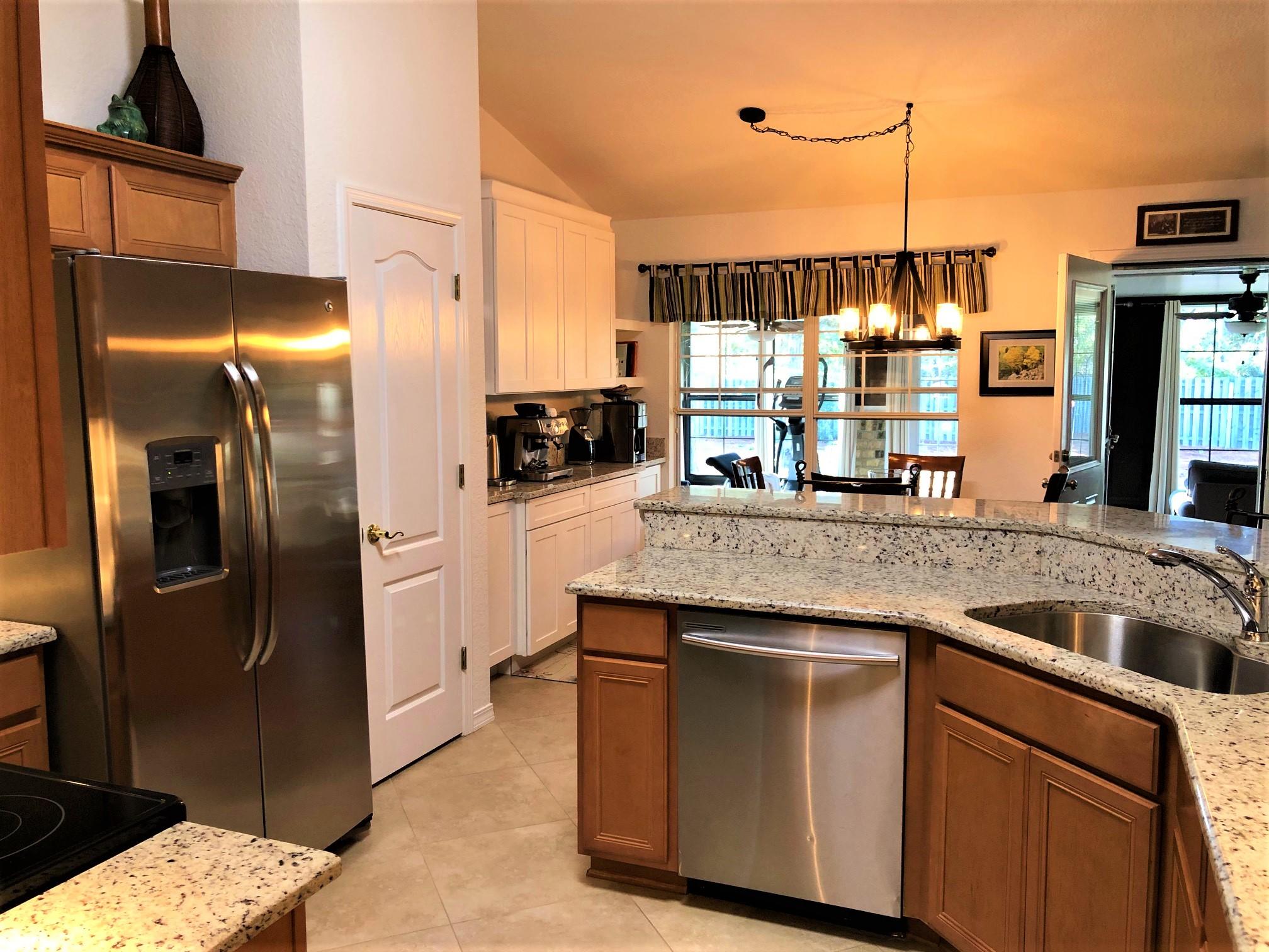 44 East Shipwreck Road Santa Rosa Beach, FL 32459 - Photo 19 of 33 a kitchen with stainless steel appliances granite countertop a refrigerator a oven and a sink