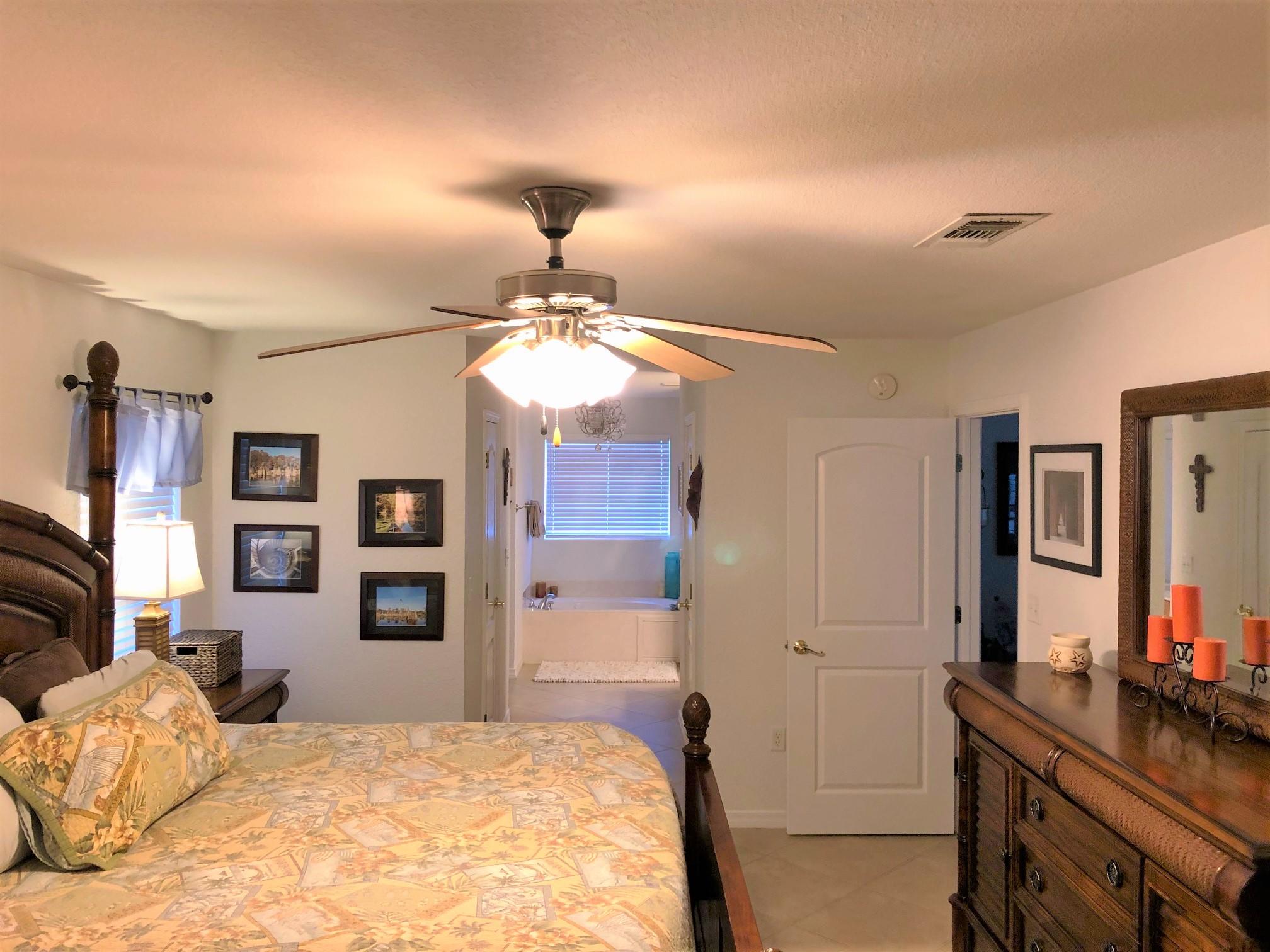 44 East Shipwreck Road Santa Rosa Beach, FL 32459 - Photo 24 of 33 a bedroom with a bed and a flat tv screen on dresser