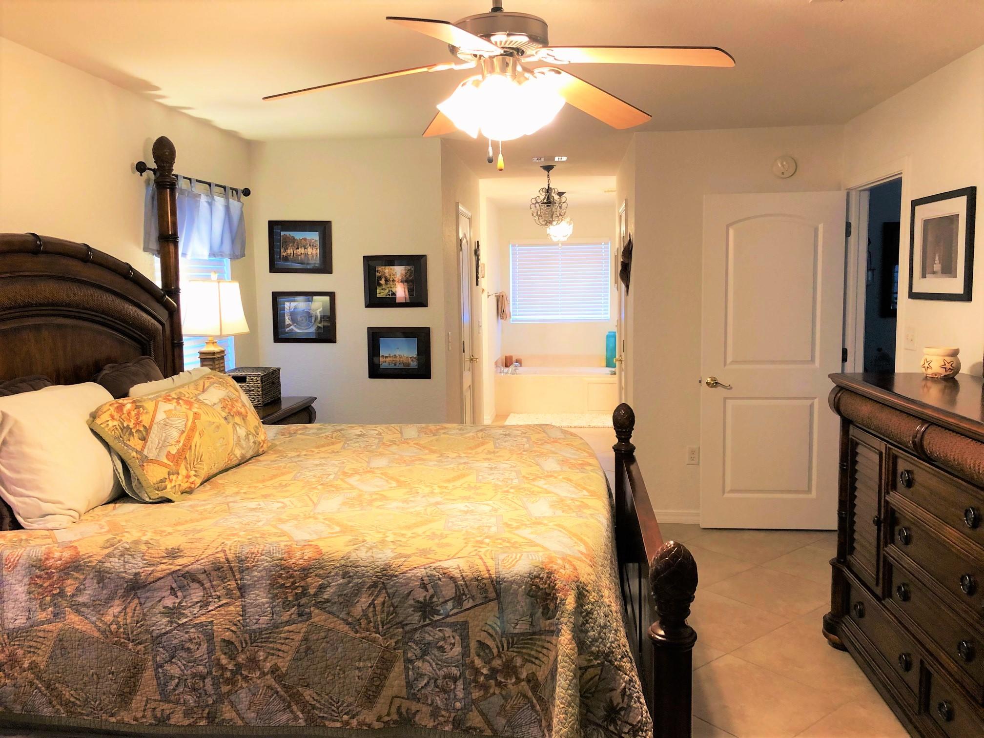 44 East Shipwreck Road Santa Rosa Beach, FL 32459 - Photo 25 of 33 a bedroom with a bed and a flat tv screen on the dresser