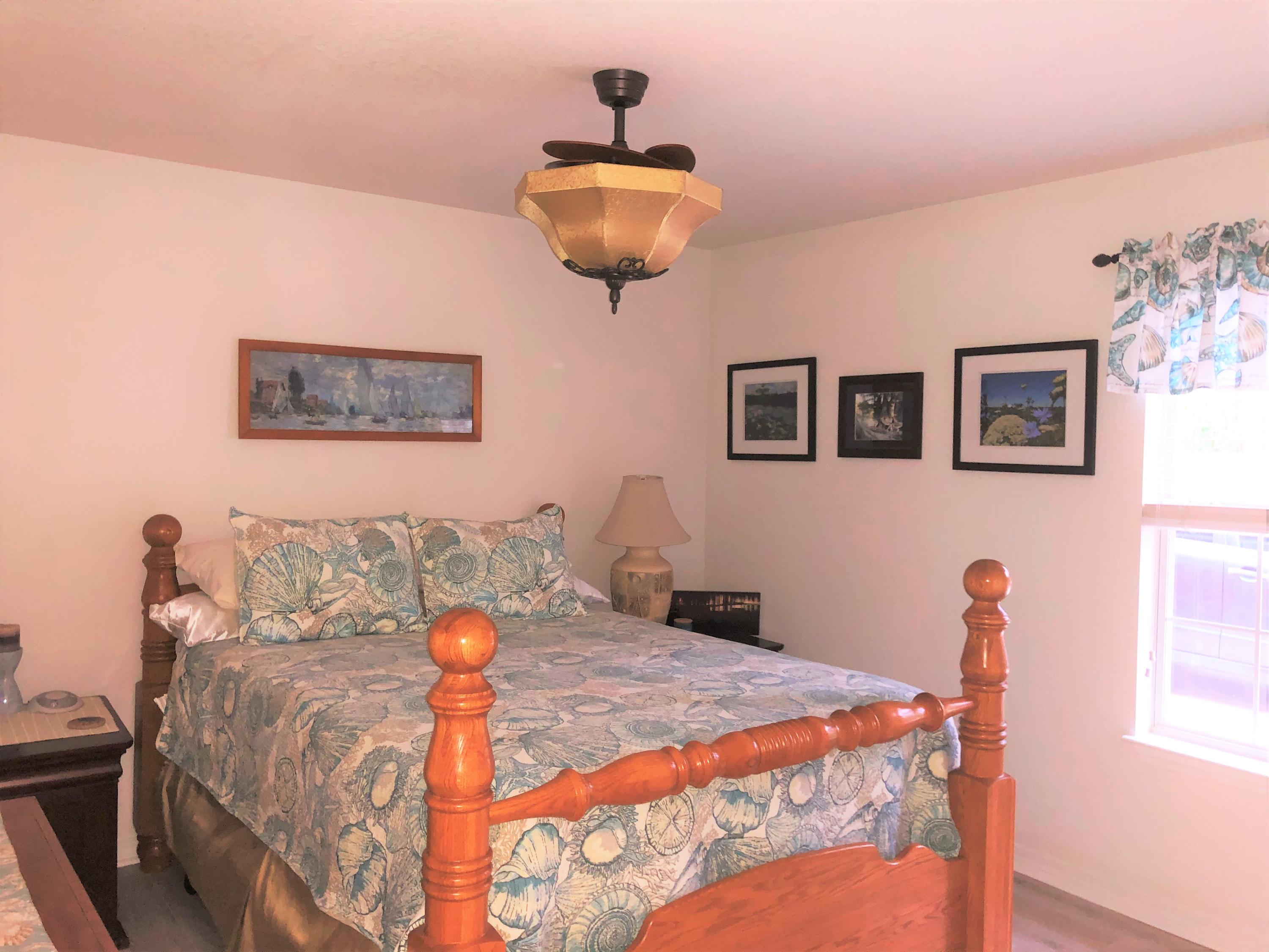 44 East Shipwreck Road Santa Rosa Beach, FL 32459 - Photo 6 of 33 a bedroom with a bed and a lamp