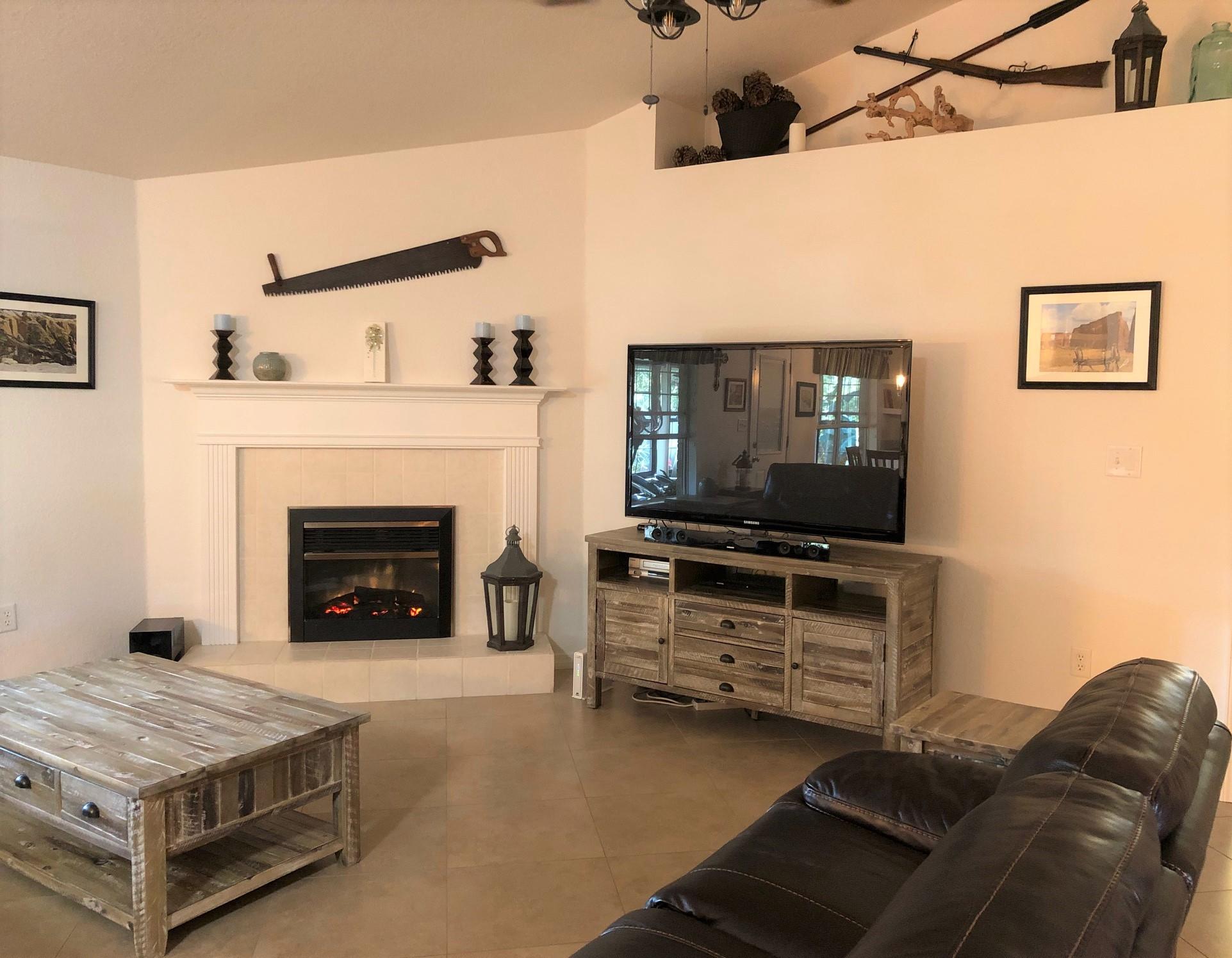 44 East Shipwreck Road Santa Rosa Beach, FL 32459 - Photo 10 of 33 a living room with furniture and a fireplace