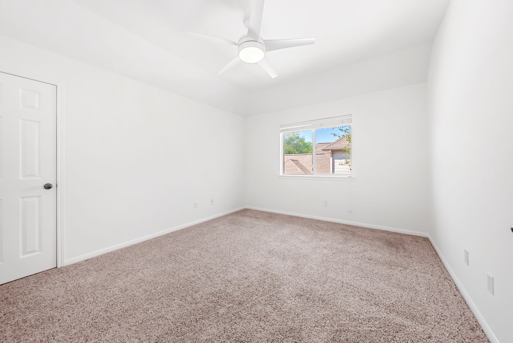 2708 Rio Mesa Drive Austin, TX 78732 - Photo 26 of 40 an empty room with a window and a fan