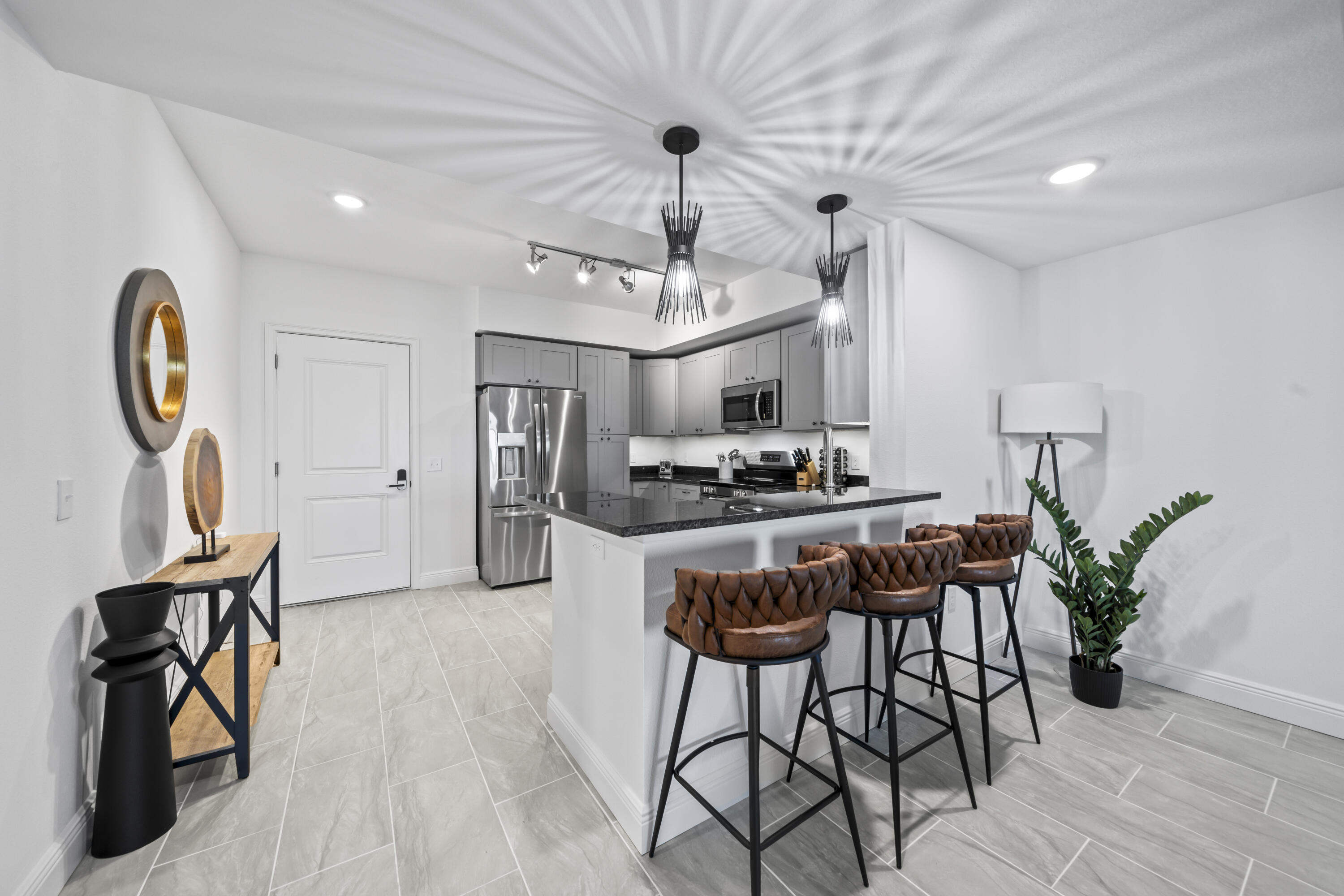 735 Pilot Lane, Unit 1004 Merritt Island, FL 32952 - Photo 11 of 46 a view of a dining room with furniture and chandelier