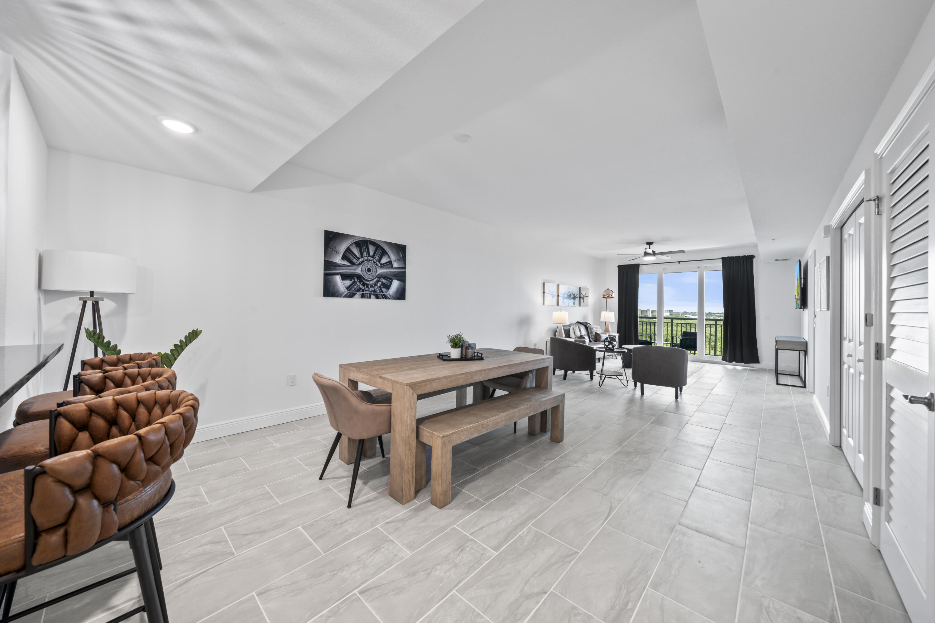 735 Pilot Lane, Unit 1004 Merritt Island, FL 32952 - Photo 13 of 46 a living room with furniture rug and window