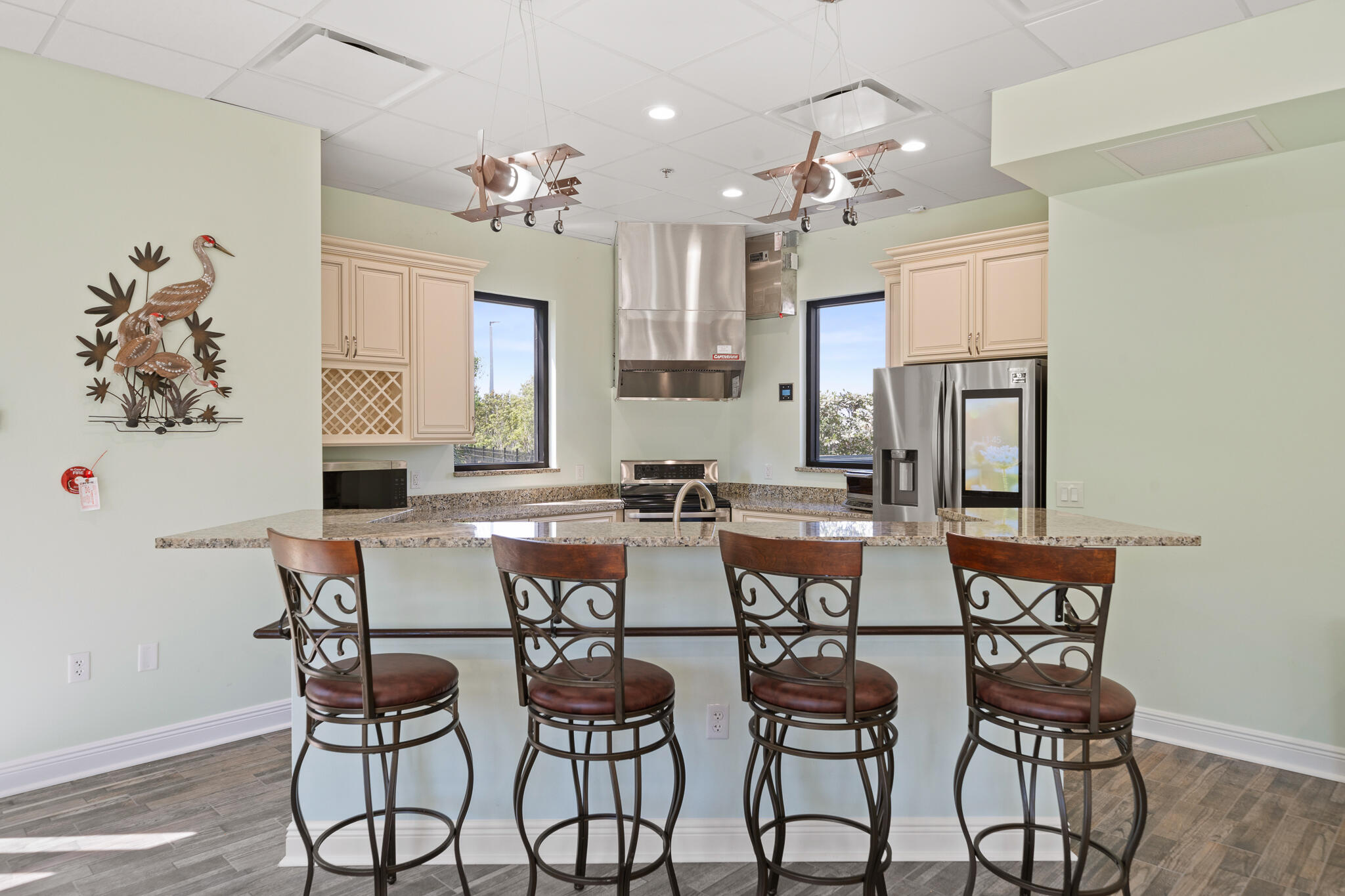 735 Pilot Lane, Unit 1004 Merritt Island, FL 32952 - Photo 22 of 46 a view of a dining room with furniture and a chandelier