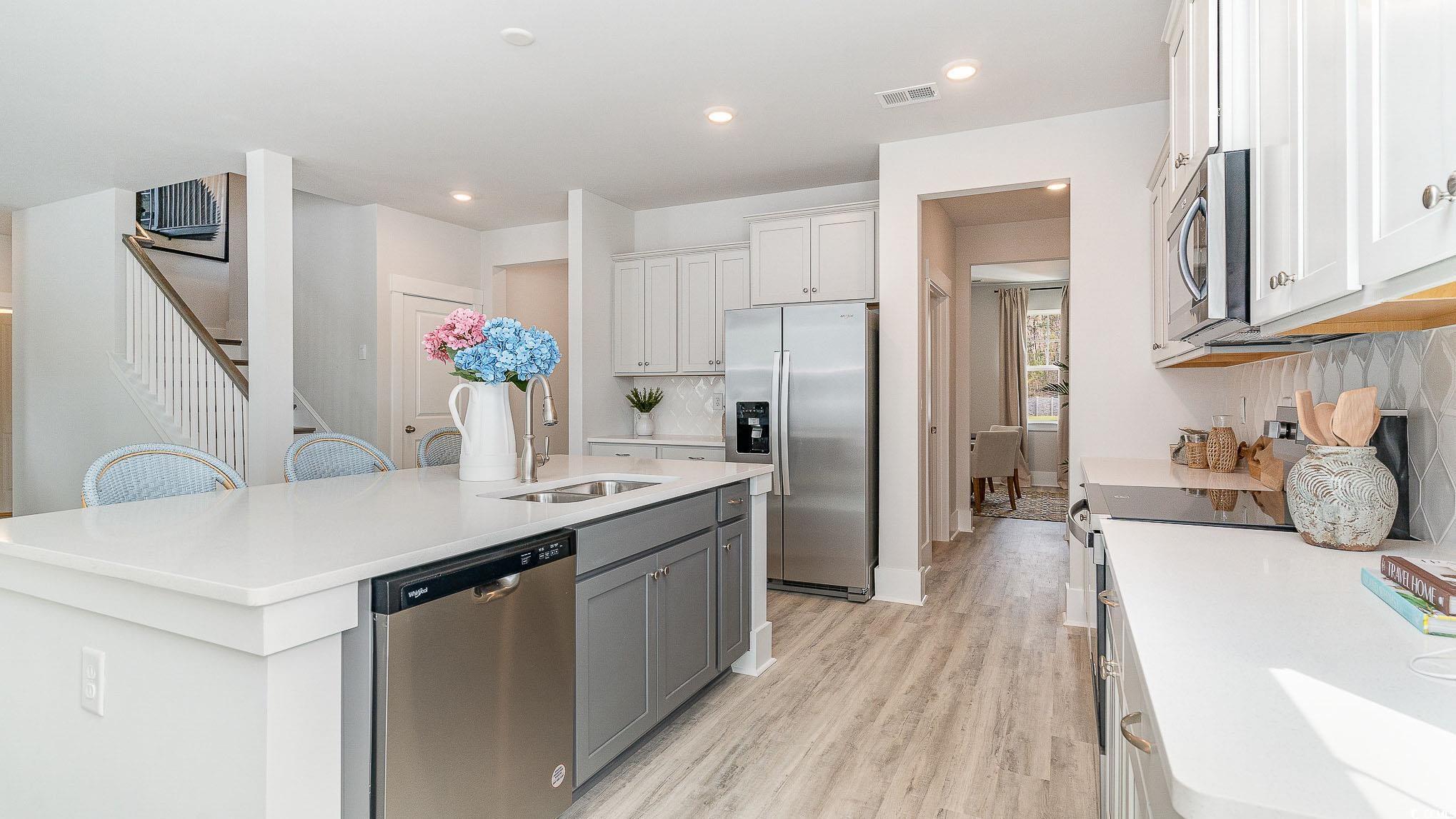 506 Haven View Way Murrells Inlet, SC 29576 - Photo 13 of 40 Kitchen with appliances with stainless steel finishes, a sink, a kitchen island with sink, light countertops, and recessed lighting