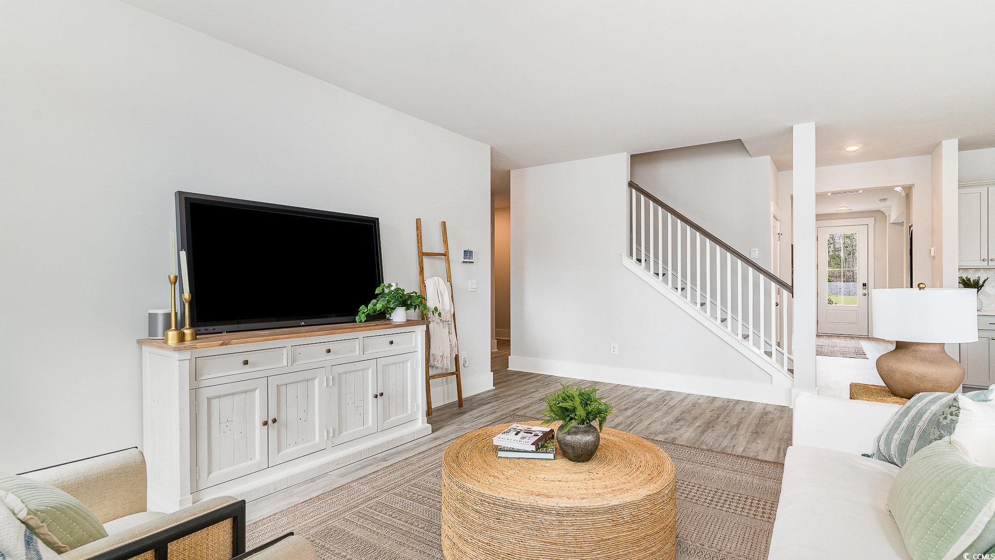 506 Haven View Way Murrells Inlet, SC 29576 - Photo 6 of 40 Living room featuring stairway, light wood-type flooring, and baseboards
