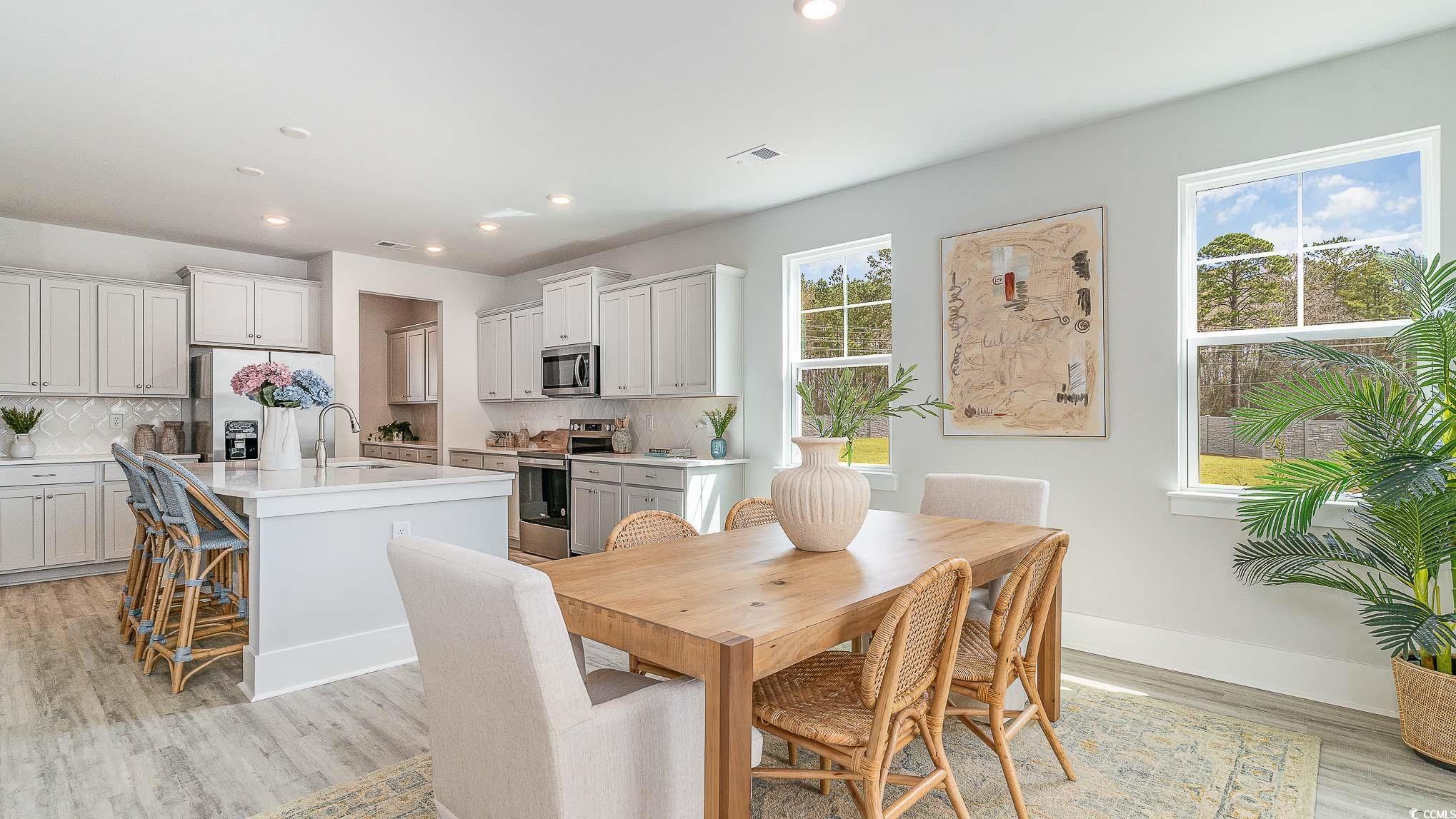 506 Haven View Way Murrells Inlet, SC 29576 - Photo 9 of 40 Dining area featuring recessed lighting, light wood-type flooring, and baseboards
