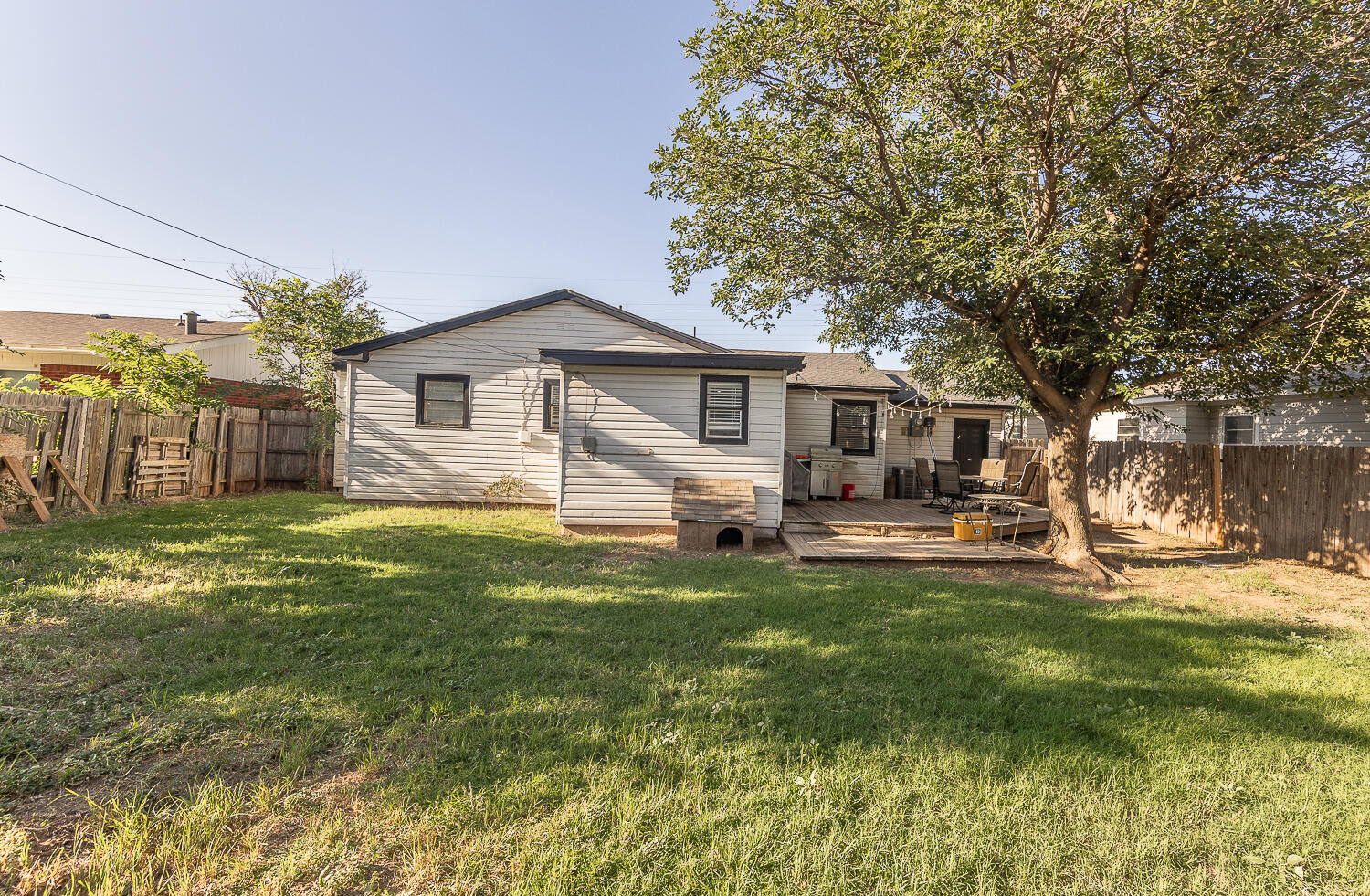 4206 42nd Street Lubbock, TX 79413 - Photo 21 of 25 a front view of a house with a garden and trees