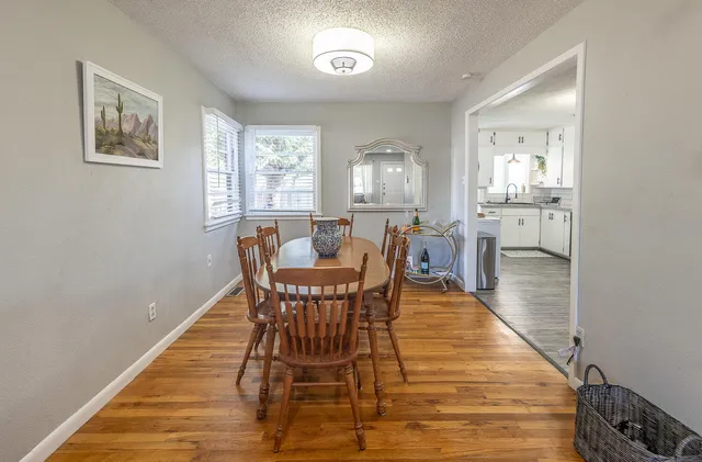 a view of a dining room with furniture and window