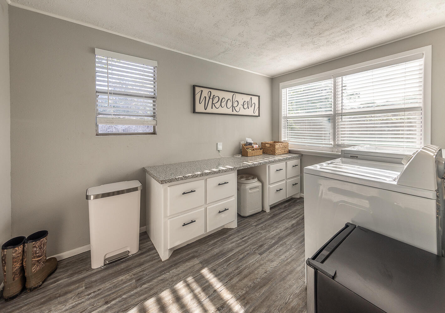 4206 42nd Street Lubbock, TX 79413 - Photo 9 of 25 a view of cabinets a sink and a stove in a room