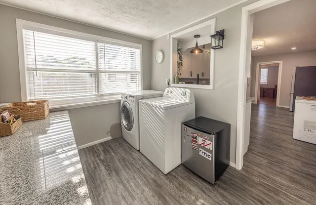 a utility room with washer and dryer