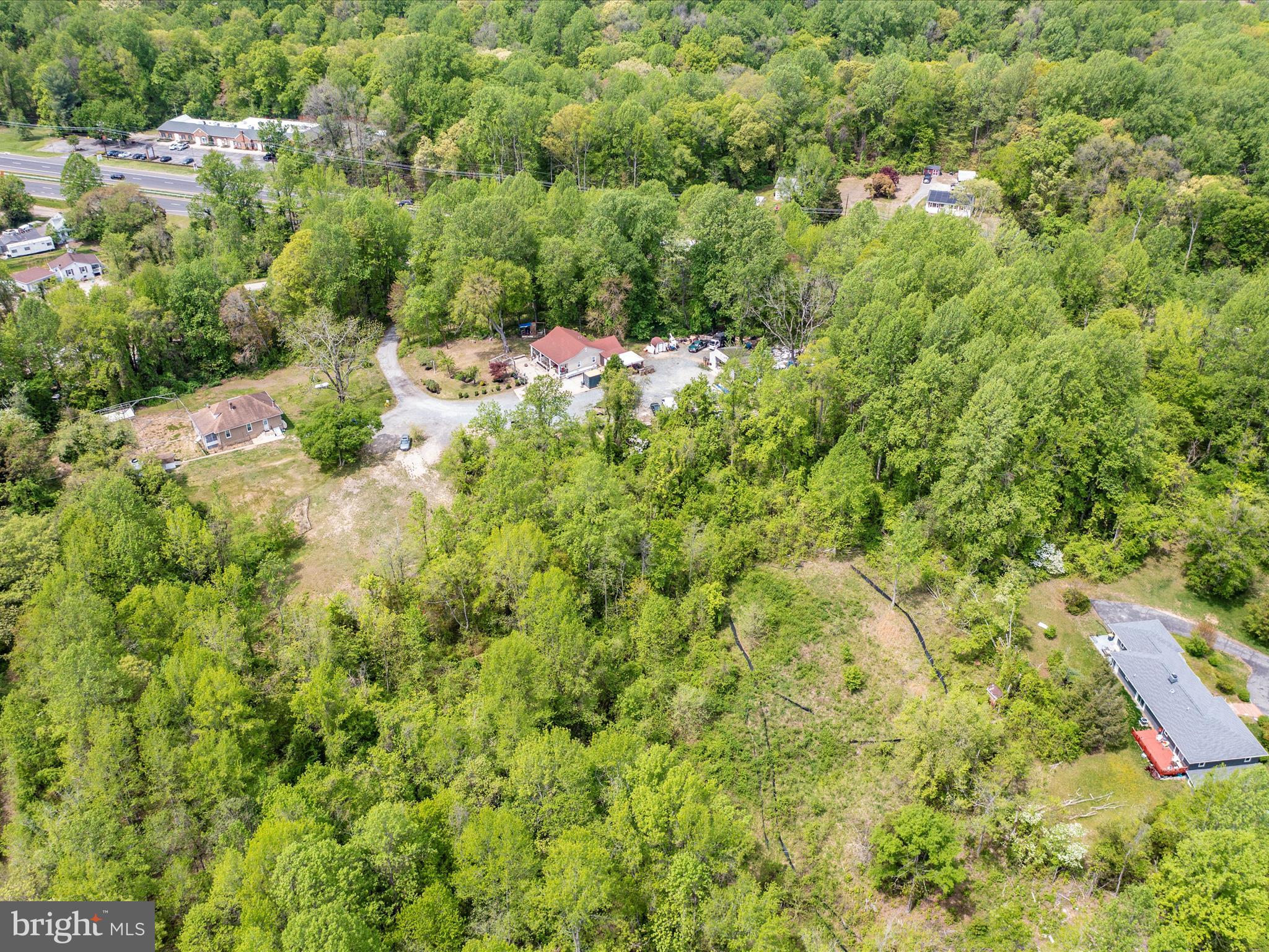 6205 Curtis Road Upper Marlboro, MD 20772 - Photo 10 of 20 an aerial view of residential house with outdoor space and trees all around