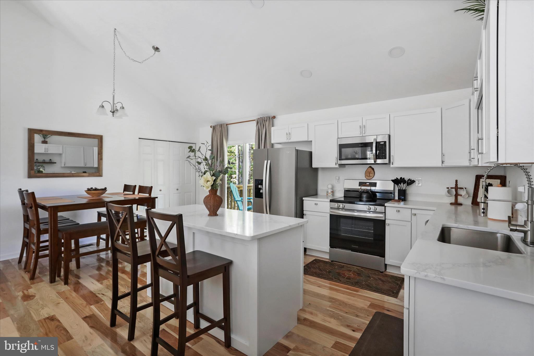 598 Crabapple Road Mount Jackson, VA 22842 - Photo 13 of 32 a kitchen with stainless steel appliances granite countertop a stove a refrigerator a kitchen island a table and chairs