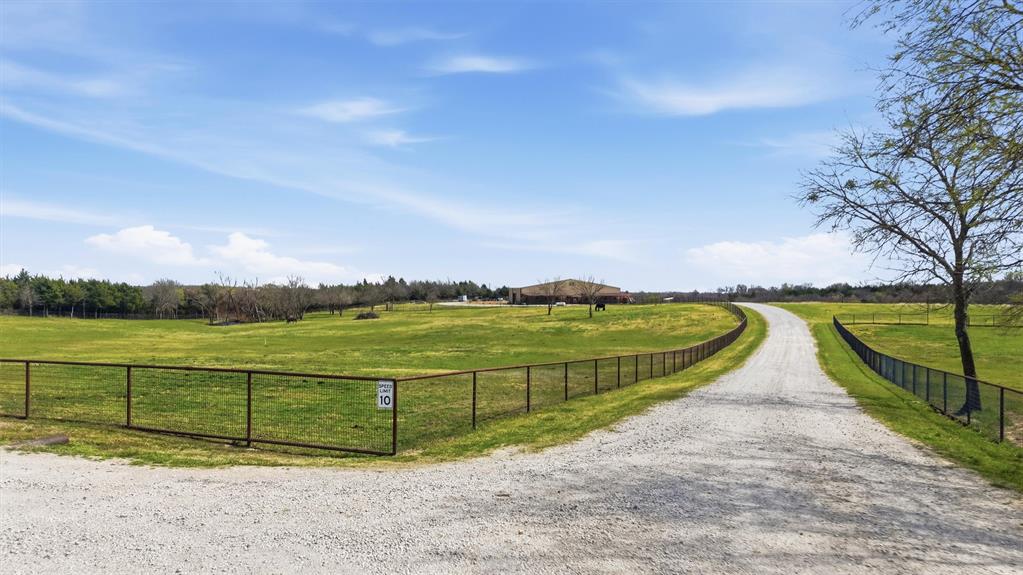 1470 Preston Road Denison, TX 75020 - Photo 2 of 24 Extensive gravel driveway welcomes you to this picturesque property in a prime location in fast-growing Denison, TX.