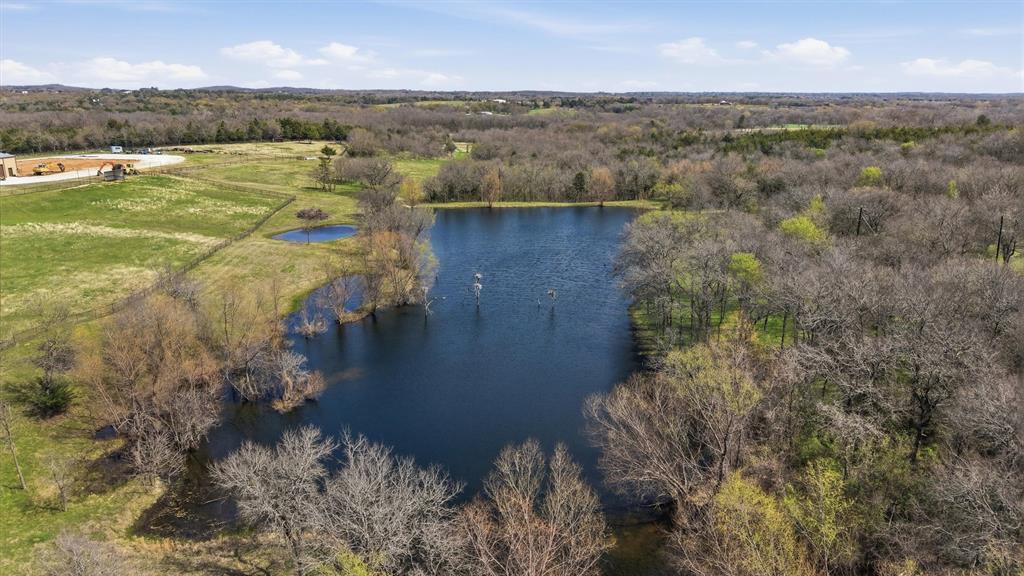 1470 Preston Road Denison, TX 75020 - Photo 9 of 24 Beautiful large pond is 8-9 feet deep in the middle. Fantastic potential home build sites overlooking the pond.