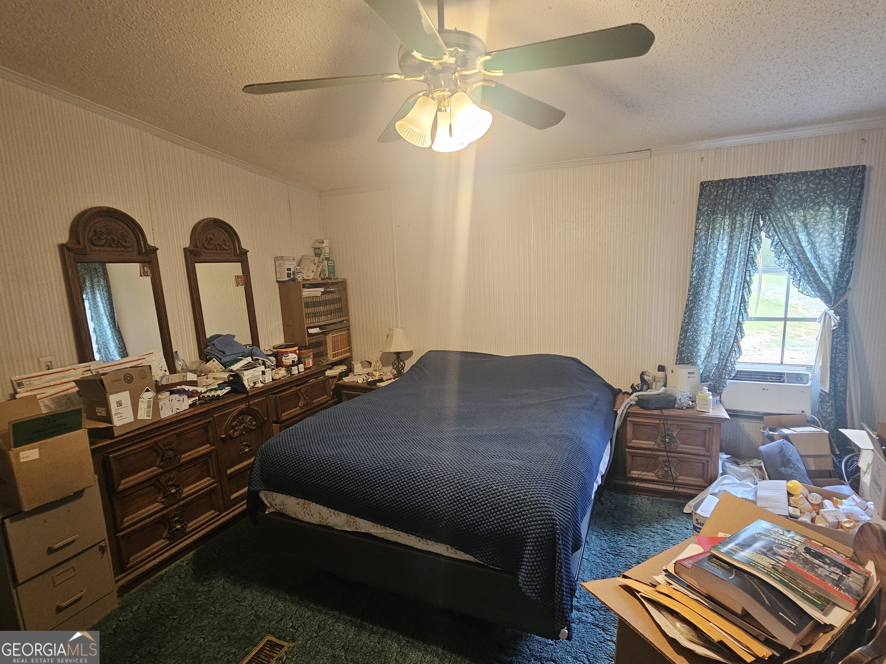 267 Williams Road Tallapoosa, GA 30176 - Photo 9 of 14 a bedroom with bed or couch and a chandelier