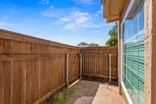 a view of a back yard from a balcony