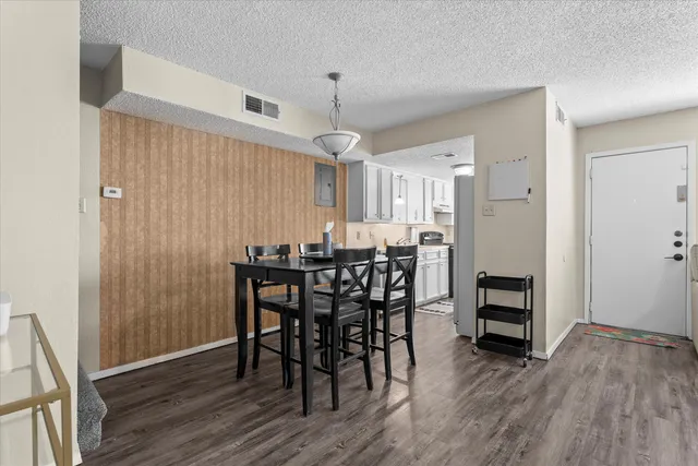 a kitchen with a stove and a refrigerator