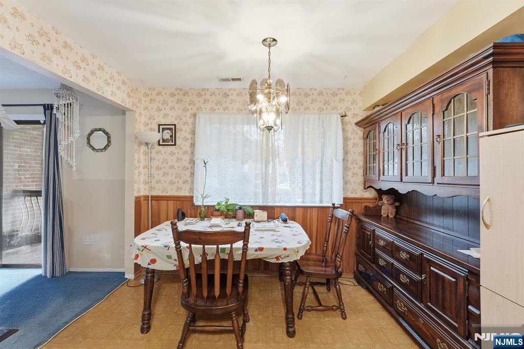 307 Edison Glen Terrace, Unit 307 Edison, NJ 08837 - Photo 5 of 10 a dining room with furniture and window