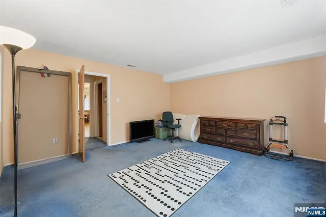 a view of an empty room and a window