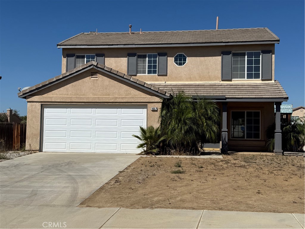 1657 Stone Creek Road Beaumont, CA 92223 - Photo 1 of 32 a front view of a house with a yard