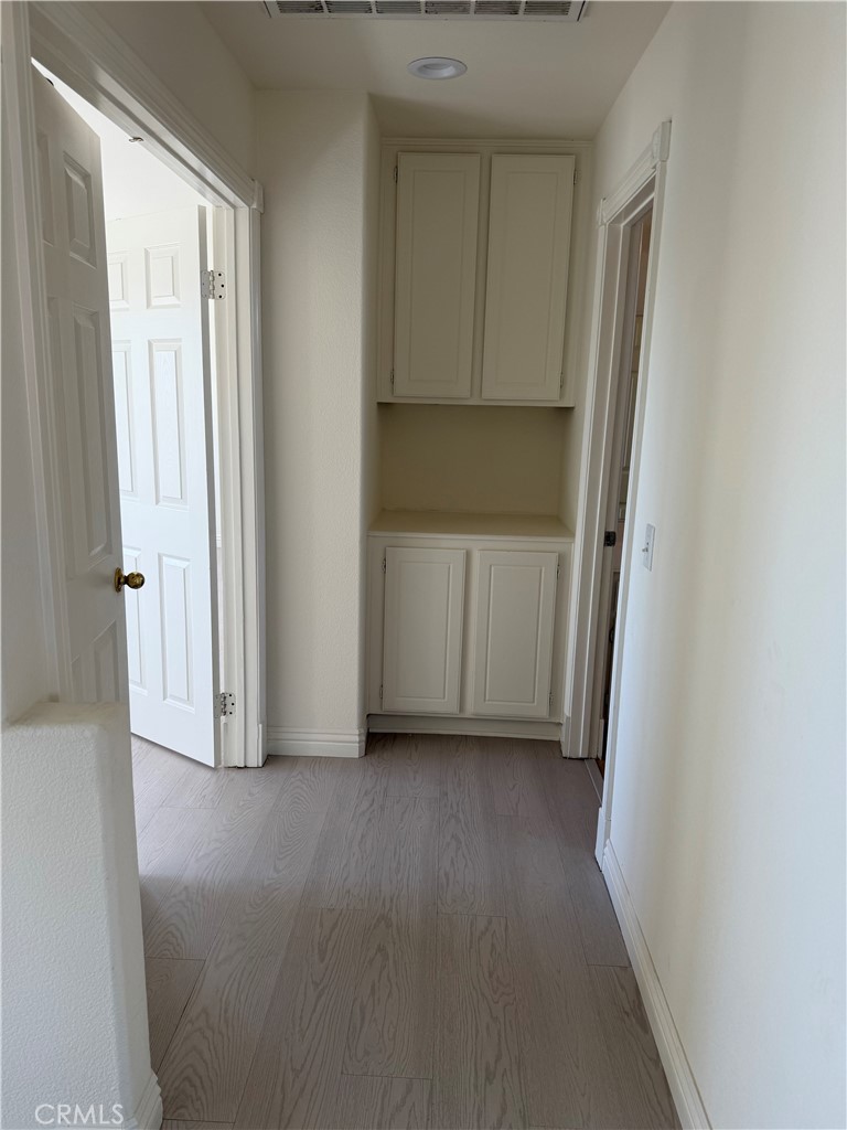 1657 Stone Creek Road Beaumont, CA 92223 - Photo 11 of 32 a view of a closet in a room