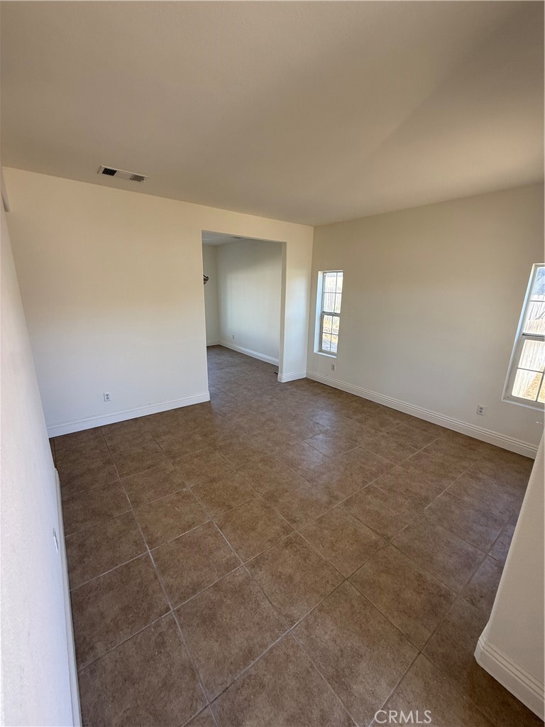 1657 Stone Creek Road Beaumont, CA 92223 - Photo 2 of 32 wooden floor in an empty room