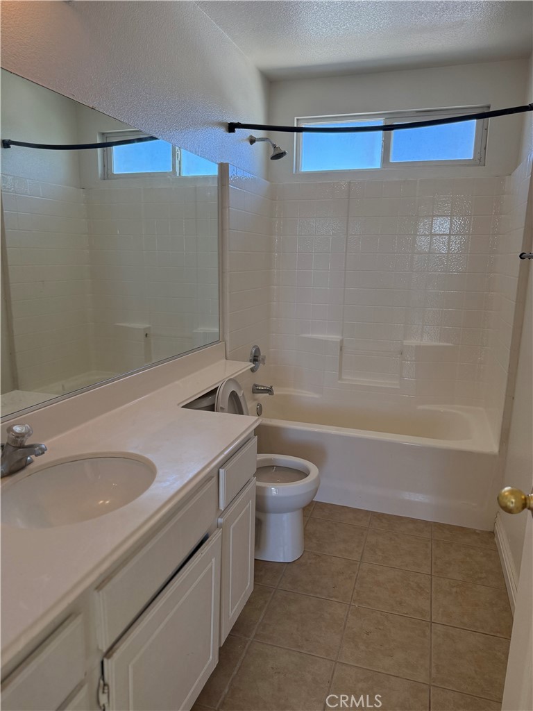 1657 Stone Creek Road Beaumont, CA 92223 - Photo 23 of 32 a bathroom with a sink a toilet and shower
