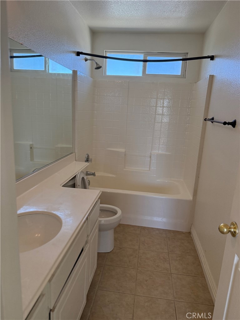 1657 Stone Creek Road Beaumont, CA 92223 - Photo 28 of 32 a bathroom with a sink a toilet and shower