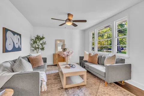 a living room with furniture and a large window
