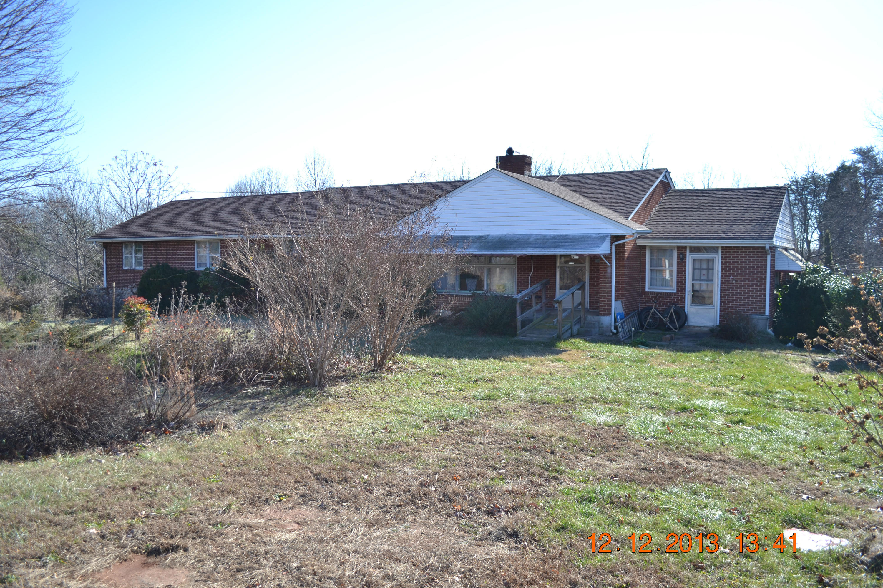 10303 Goodview Road Goodview, VA 24095 - Photo 1 of 1 a backyard of a house with lots of green space