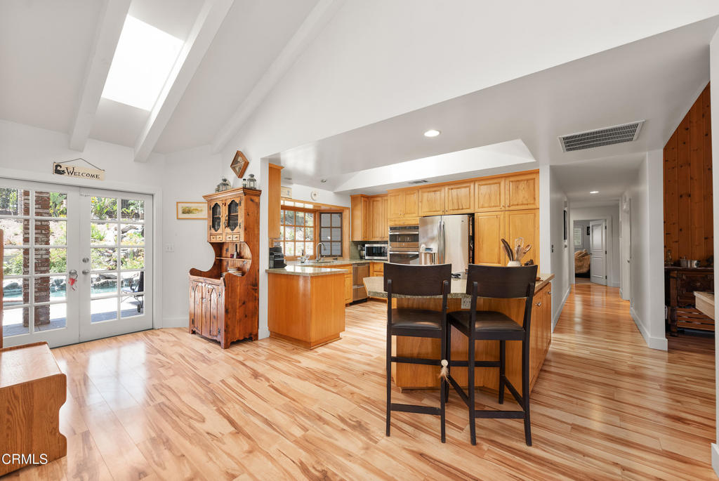 4850 North Moorpark Road Thousand Oaks, CA 91360 - Photo 15 of 54 a view of a dining room with furniture and wooden floor