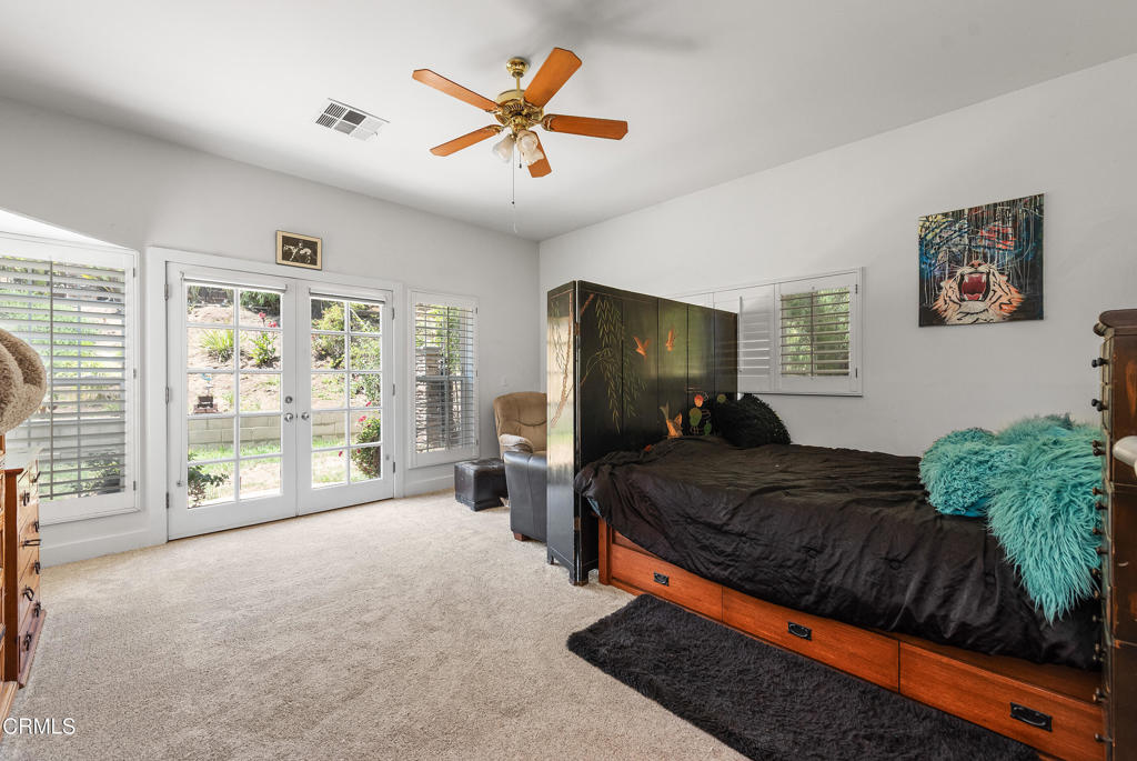 4850 North Moorpark Road Thousand Oaks, CA 91360 - Photo 26 of 54 a bed room with a bed and a large window