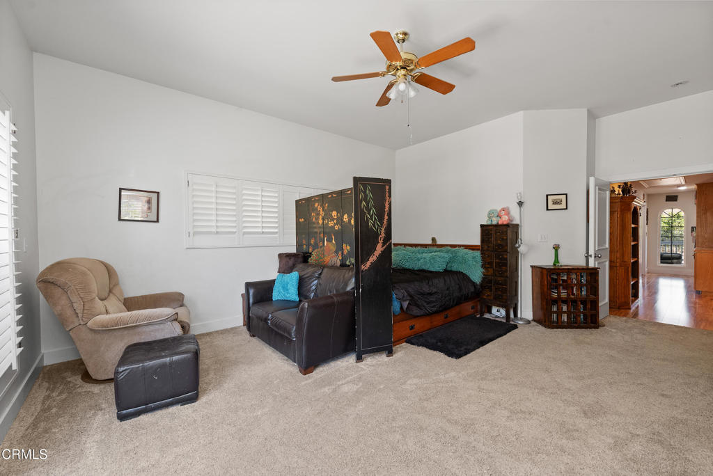 4850 North Moorpark Road Thousand Oaks, CA 91360 - Photo 27 of 54 a living room with furniture and a flat screen tv