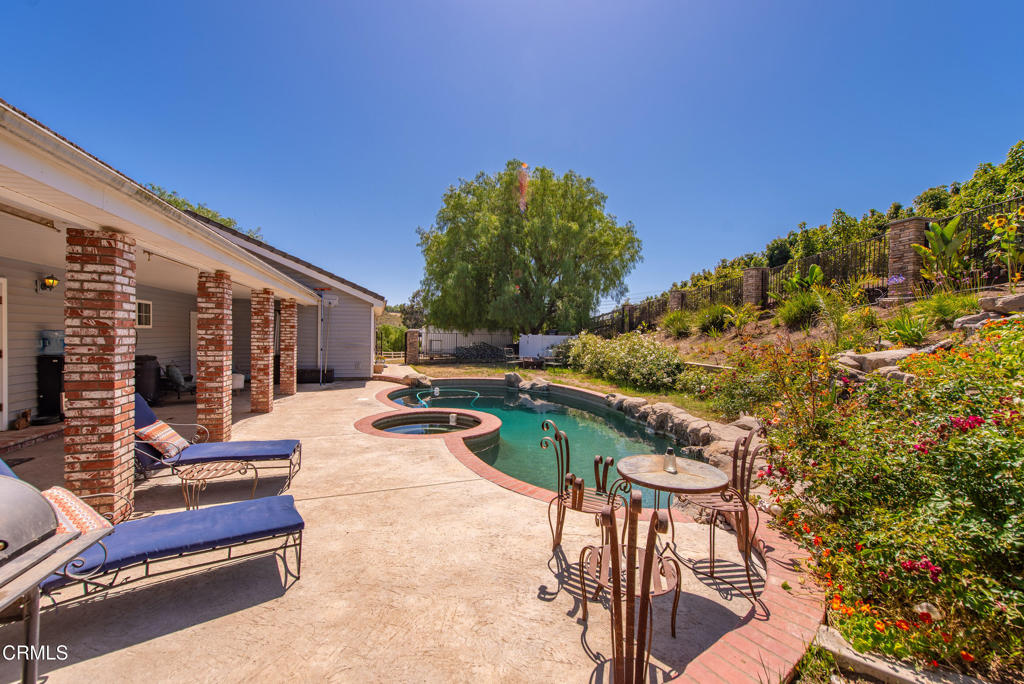4850 North Moorpark Road Thousand Oaks, CA 91360 - Photo 36 of 54 a view of swimming pool with chairs in patio