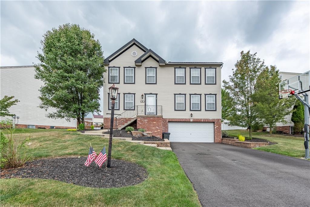 409 Commodore Drive McDonald, PA 15057 - Photo 1 of 49 a front view of a house with a yard