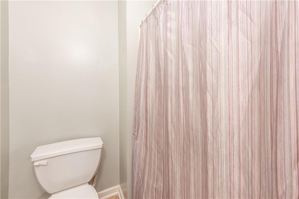 409 Commodore Drive McDonald, PA 15057 - Photo 30 of 49 a white toilet sitting next to a small window